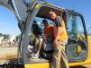 Bryan Gregor (in cab) of Gregor Well Drilling, based in Hampton Bay, N.Y., gets some operating tips on the John Deere 160G excavator from John Deere’s Alex Anhalt.