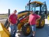 Ron Lafond (L) and Ron Wojtak, both of the city of Kenosha, take a look at this John Deere 310L backhoe with an Atlas Copco EC 70 hammer.
 