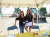 Laura Gillen (L) and Cynthia Pursche, both of McCann Industries, register guests for the equipment rodeo. 
 