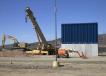 For the construction companies chosen to undertake the task, the parameters were fairly simple: Build a 30-ft. wall out of solid, reinforced concrete, The Arizona Republic reported. 