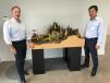 Kerry Vickar (L), chairman and CEO of May Heavy Equipment, accepts the hand-crafted construction site created by Hyundai, which was presented by M.S. Kang, president and CEO of Hyundai Construction Equipment Americas Inc.