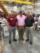 (L-R): John Santoro of Iron Horse Contracting in Raleigh, N.C., receives a warm welcome from Richie Ambrose and Jay Sellers, both of May Heavy Equipment.
