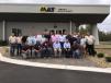 May Heavy Equipment’s staff gather in front of the new facility.
