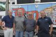(L-R) are Greg Henry of Soosan; James Hall, equipment manager of McCourt Construction Company; Carlos Monte, project foreman of McCourt Construction; and David Serra, owner of D & D Equipment Repair.
