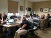 Alban Cat’s staff gathers in “the war room.” This is one of the company’s busiest sales of the year.