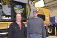 Checking out the latest features of the Gradall excavator are Dan Bobnick (L) of the town of Hartwick and Bill Hriver of the town of Otego.