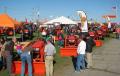 Guests visit the Kubota exhibit area featuring a lineup of construction, farming and turf management machines. 
 