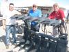 This Virnig root rake grapple sold at the show. (L-R) are Eric Easter, Ross Waterman, and Curtis Goettel, all of Virning, based in Rice, Minn.
 