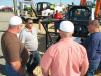 Eric Floyd (C), Bobcat and Doosan dealer representative of Rental Inc., Dothan, Ala., provides valuable information on product offerings for the agricultural industry.  
 