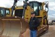 Justin Coleman, West Texas account manager of Worldwide Machinery, inspected the long line of dozers, including this Cat D8T. 