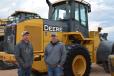 Caleb Adams (L) and Kyle Workman of Diamond J Oilfield Services have wheel loaders on their minds. They seem to be interested in one of the John Deere 644s that is for sale. 