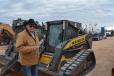 Rancher Ricky Trammel traveled to Odessa from Waco, Texas, to buy a skid steer. The New Holland C185 was one of several he inspected. 