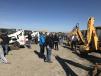 Customers place their bids on the farm and construction equipment. 