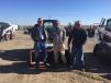 The crew from Dial Construction, Ottumwa, Iowa, take a break from bidding during the Midwest farm and construction equipment auction.
 