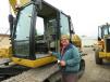 Art Fish, owner of Fish Drainage Company, checks the stick of this Cat 324DL long-reach excavator. 
 