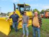 (L-R): Matthew Lounsberry, Roland Machinery Co., goes over the Komatsu equipment lineup with Brandon France, owner of France Bulldozing, and Brad Batterton, also of France Bulldozing.
