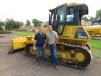 Ryan Spearie (L) and Ian Krispin, both of Halverson Construction Co., zero in on this Komatsu D51 PXi dozer in the demo area. 
