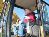 Cliff Campbell of C&C Equipment, Hattiesburg, Miss., test operates a Cat 320C in the sale lineup. 