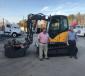 Scottie Holcomb (L), product support manager, and Brian Meissen, sales manager, both of Reynolds-Warren Equipment Company stand with one of the first Mecalac machines delivered to the company’s Forest Park, Ga., headquarters facility.