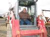 Brent Londeree of Legacy Excavating, based in Columbus, Ind., test operates a Takeuchi TL10 compact track loader.
