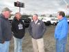 (L-R): Railroad contractors Mike Lee and Kevin Muench of Iron Horse Inc., St. Louis, Mo.; Jeff Martin, owner of Jeff Martin Auctioneers; and Chris Arnold, A-Cranes, Tampa, Fla., discuss the terrific lineup of trucks and machines in the sale.