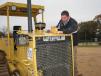 Jason Paris, independent contractor based in Deatsville, Ala., checks out the radiator and fluid on a Cat D6N. 
