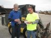 James Carter (L) and Kirk Spencer, both of Spencer’s Construction Services, Senoia, Ga., look to pick up some bargain priced skid steer loaders for their company. 