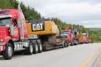 Caterpillar equipment is delivered to Oak Island. 
