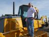 Jim Tirone, used equipment manager, Five Star Equipment Inc., the John Deere dealer from Dunmore, Pa., checks out a Deere 750 series dozer.
