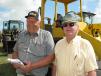Checking out the wheel loaders while enjoying the Florida sunshine are Jim Thorpe (L), Thorpe Farms & Implements, Gary, S.D., and Ray Haluch of Ray Haluch Inc., a sand and gravel producer from Ludlow, Mass.