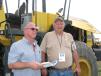 Looking to snag a deal on a wheel loader or two are Chris Johnson (L) of ALTA Equipment, New Hudson, Mich., and Steve Heckman of L C Whitford Co., Wellsville, N.Y.