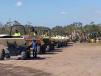 A very large collection of compact dumpers go over the ramp at the Yoder & Frey auction.
 