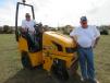 The father and son team of Brandon and Brad Pardieck of BP2 Construction, Seymour, Ind., inspect this JCB VMT160 roller.
 