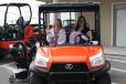 Guests take a spin on the Kubota equipment. 
 