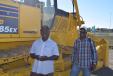 Orgill Dennis (L) and Ronald Bartley from Alumina Products Sales & Service, Mandeville, Jamaica, would like to put this Komatsu 85EX dozer to work back home.
