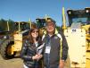 Claudia Castano (L) and Homber Antonio Virviescas, both of Global Equipment, Charlotte, N.C., show interest in some of the larger iron, including a package of Volvo G930B’s in the sale line-up. 