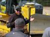 B.J. Bauman, a John Deere WorkSite technology solutions instructor, goes over the relationship of optimal hydraulic performance and the machine calibration unit to ensure the machine is cutting the best grade.