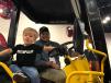 Young Masson Garrett seems to be somewhat confused as he “test drives” a Sakai double-drum asphalt roller while donning a Caterpillar T-shirt. His father Stephen Garrett is of Lone Star Paving, Franklin, Tenn. 