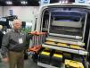 Dejana Trucks & Utility Equipment’s Rich Idtensohn demonstrates the benefits offered by the company’s  internal ladder rack in terms of  reduced wind resistance and security. 