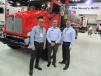 (L-R): Frank Flores, Mark Wagner and John McCoy, all of Kenworth Truck Company,  showcase the company’s work trucks at the event. 
 