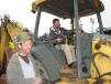 Test operating a John Deere 310G backhoe-loader are Tim (L) and Tony Cruce, independent contractors based in Suches, Ga.

