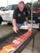 Mason Tractor’s Bandit chipper specialist, Randy Rawlins served as “grill master” for the day.  
