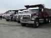 More than 50 Mack tri-axle dump trucks went down the ramp at the recent Ritchie Bros. auction sale held at its North East, Md., facility.