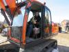 Jake Saxton, Saxton & Smith Excavating & Landscaping, tries out this Doosan DX 225LC excavator.