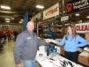After spinning the prize wheel, Mark Deutsch of Northland Concrete, receives a flashlight from Courtney Cummings, RMS graphic designer and marketing assistant.
