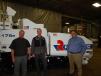 (L-R): Dave Miller, regional sales manager, Roadtec, Chattanooga, Tenn.; David Johnson, RMS vice president sales and marketing; and Paul Schratz, national sales manager, central region, Roadtec, go over the features of this new Roadtec RP-175E.
