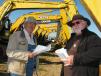 Donnie Richardson (L) of D&S Farms, Aberdeen, Miss., and Billy Scurlock, a land developer based in Chelsey, Ala., were interested in several of the hydraulic excavators in this sale.  
