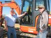 Charles Brown (L) of Hilltop Motors, Columbia, La., and Brian Steele of W&W Truck and Trailer Sales, Carmi, Ill., inspect a really nice Kubota KX057-4 of common interest.
