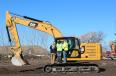 Steve Skeen of H.O. Penn shows these operators the features and benefits of the Cat Next Generation 320 excavator.