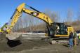 A Local 15 member operates a Caterpillar 323F excavator during the event.